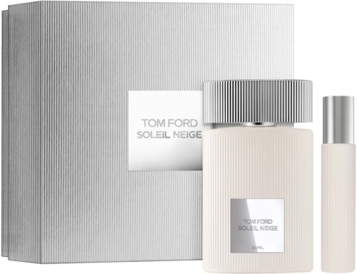 A Tom Ford Soleil Neige perfume set with a box, a large bottle, and a smaller spray, all in sleek silver and white.