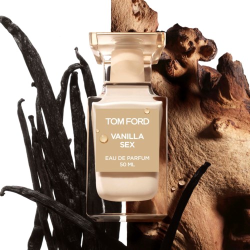 A perfume bottle labeled "Tom Ford Vanila Sex" on rocks and sticks background. It is a glass bottle with a beige cap.