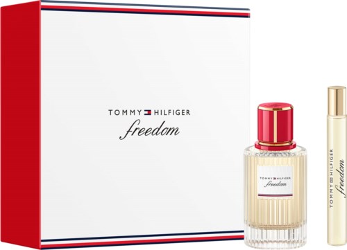 Tommy Hilfiger freedom parfymgåva med en flaska som har en röd lock och ett guldrör.