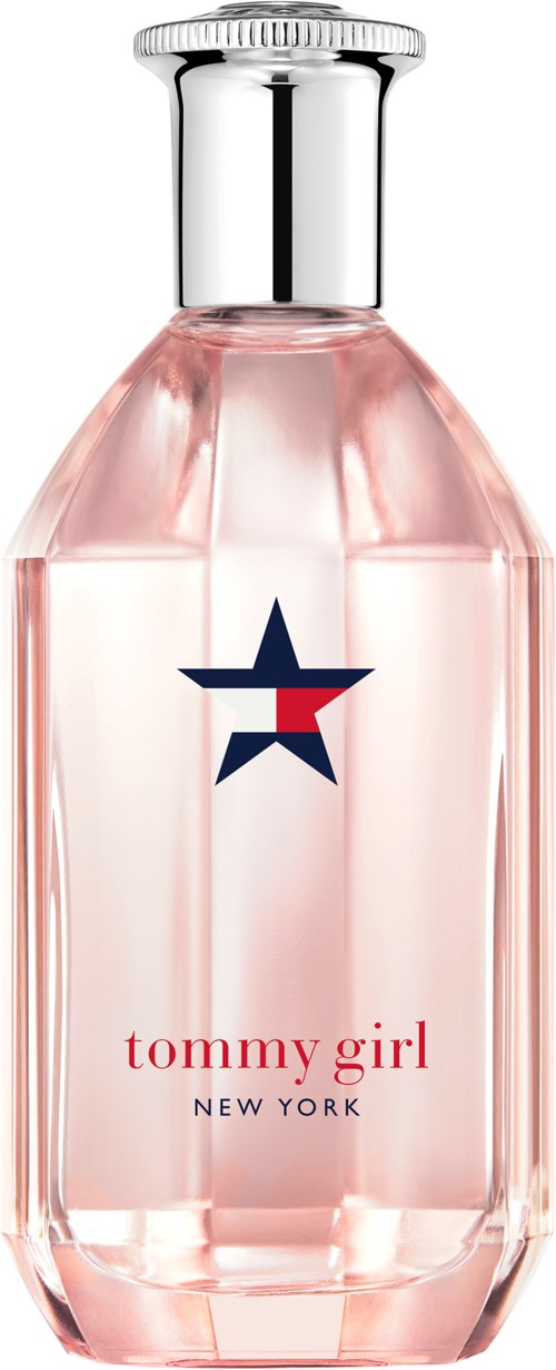 A clear pink perfume bottle with a silver cap, displaying a star logo and the words "tommy girl" and "New York."