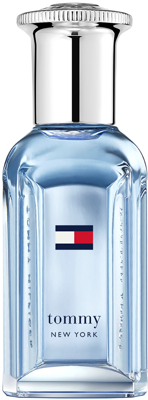 A perfume bottle with blue liquid, silver cap, and Tommy New York logo on the front.