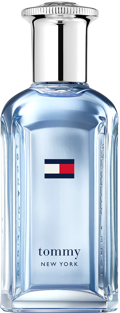 A clear perfume bottle with a silver cap, featuring a logo with red, white, and blue colors, and the words 'tommy NEW YORK'.