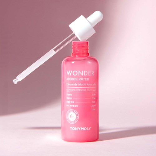 Pink bottle with a dropper, labeled 'Wonder Tonymoly', likely for skincare or serum.