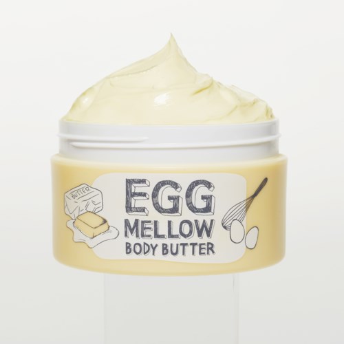 Ein Behälter mit sanftem Ei-Körperbutter, cremige Textur und einfache Beschriftung.