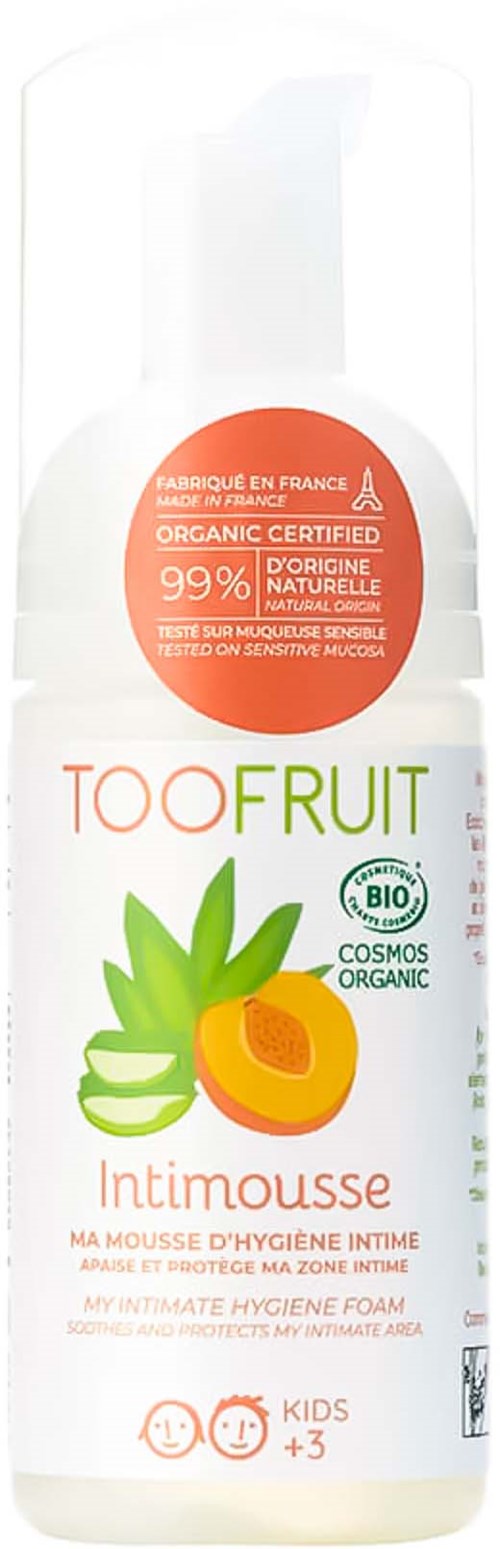 A white bottle with green leaves and an apricot image, labeled for intimate hygiene foam, suitable for kids older than three.