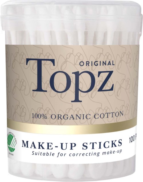 A white container with a label that says "Topz" and "100% organic cotton." It contains makeup sticks for correcting makeup.