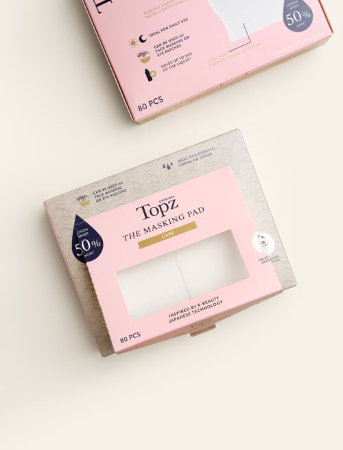 Pink and gray packaging for Topz face mask pads, 80 pieces, with a clear window showing some pads inside.