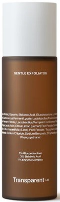 Braune Flasche mit weißem Deckel, Beschriftung ‘Gentle Exfoliator’ und Inhaltsstoffliste, wahrscheinlich ein Hautpflegeprodukt.