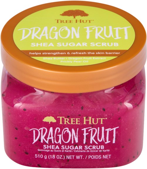 Lys rosa krukke med Tree Hut Dragon Fruit Shea Sugar Scrub, oransje lokk og etikettdetaljer.