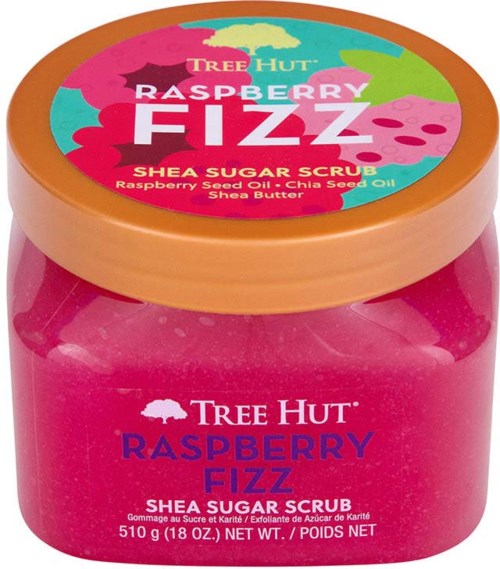 Ein rosa Behälter mit buntem Deckel, beschriftet als Tree Hut Raspberry Fizz Shea Zuckerpeeling mit Inhaltsstoffen.