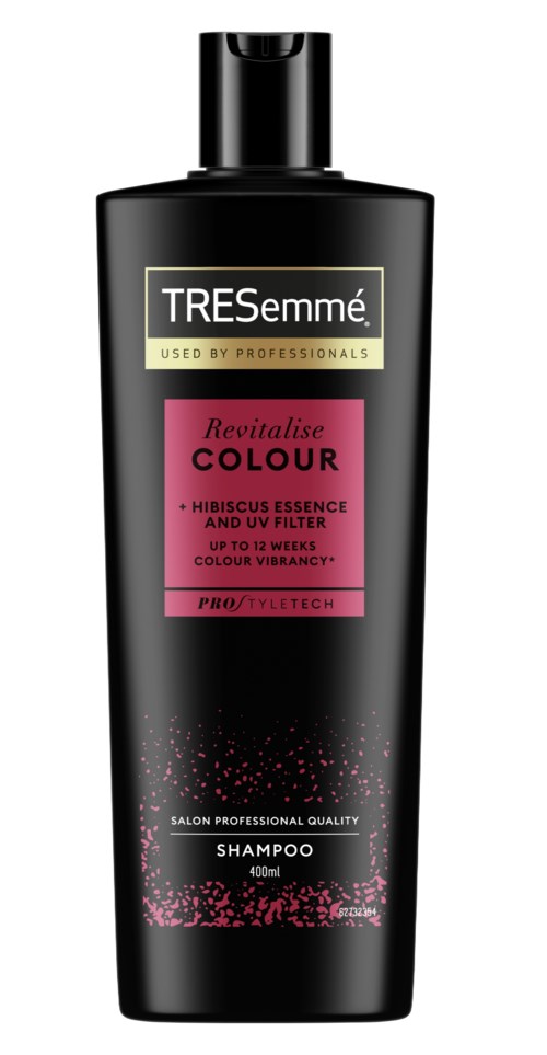 A black shampoo bottle with pink and white label. The label has the brand TRESemmé and mentions colour revitalising with hibiscus.