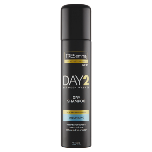 A black can of TRESemmé dry shampoo with gold and blue accents, labeled for volume and freshness.