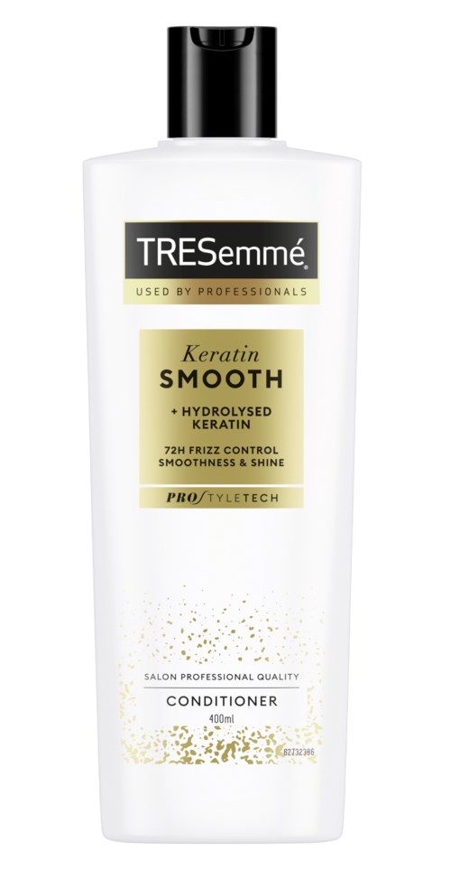 A white conditioner bottle with black cap, labeled TRESemmé Keratin Smooth, used by professionals for hair care.