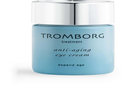 Eine blaue Dose mit Augencreme und silbernem Deckel, gekennzeichnet als Anti-Aging-Behandlung für wachsendes Alter.