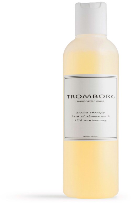 Eine weiße und gelbe Flasche mit 'TROMBORG' Aufschrift und weißem Deckel, vermutlich Körper- oder Duschgel.