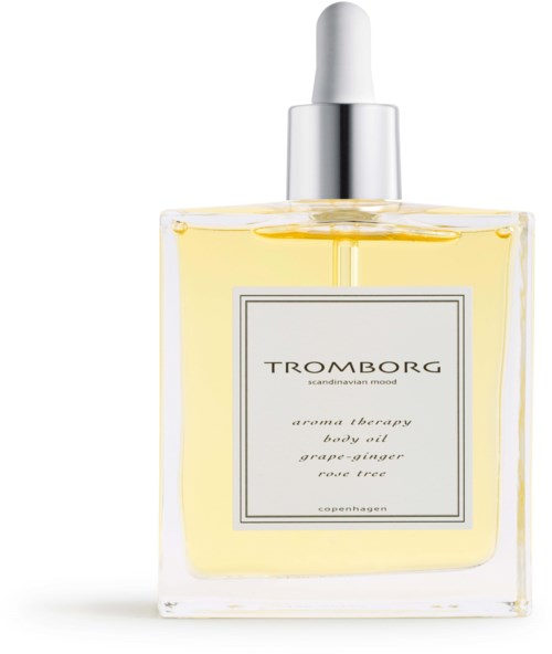 Eine klare Glasflasche mit Körperöl, weißem Deckel und silberner Pipette, Etikett liest Tromborg aroma therapy.