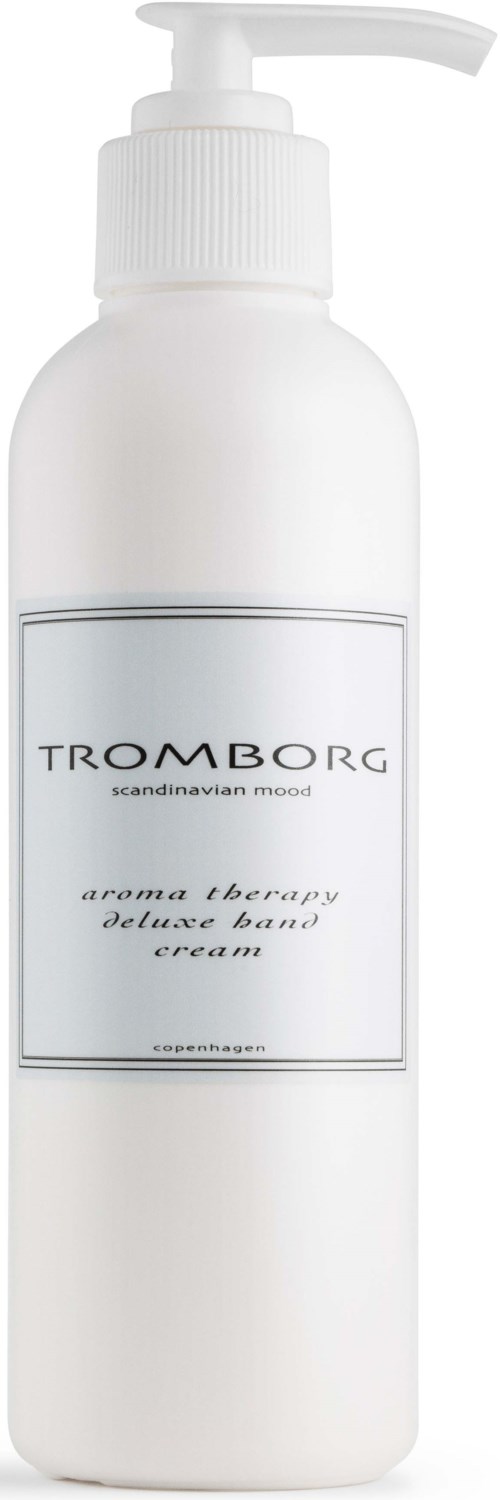 Eine weiße Flasche mit Pumpspender, beschriftet Tromborg aroma therapy deluxe hand cream.
