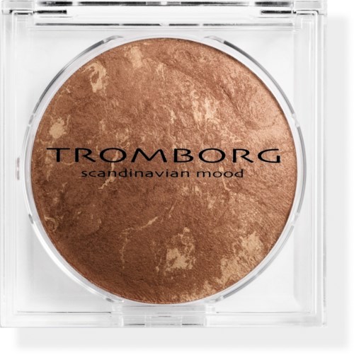 A round makeup product with a brown marbled surface, labeled 'Tromborg Scandinavian Mood', in a clear plastic case.
