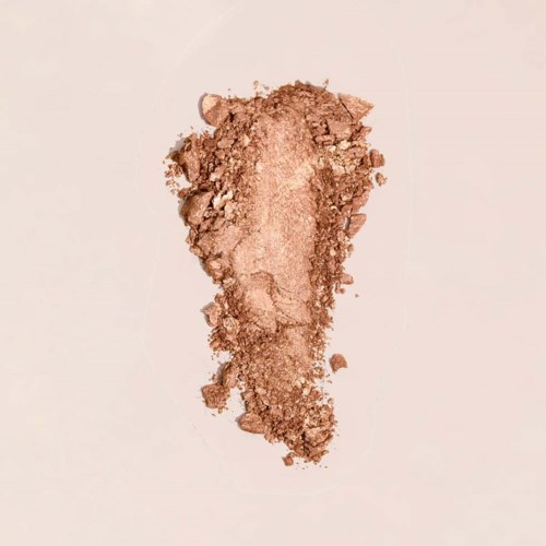 A crushed brown powder in the shape of a footprint on a white background.
