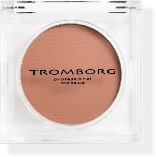 A compact blush with a clear case and the brand name Tromborg printed on it.