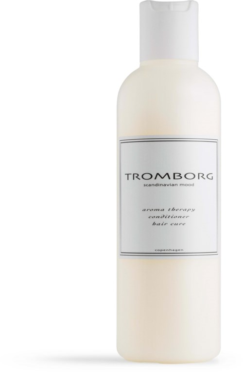 A white bottle with a minimal label displays the brand Tromborg and a description of its scent.