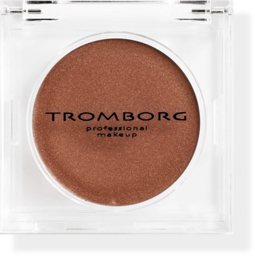 A round makeup product in a clear container with brown color and black text. It says "Tromborg" and "professional makeup."