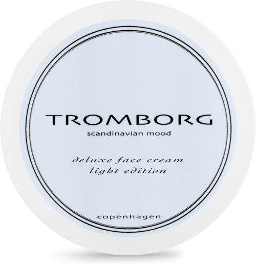 Eine hellblaue runde Verpackung mit 'Tromborg' Beschriftung, Text über Gesichtscreme, skandinavische Stimmung und Kopenhagen.