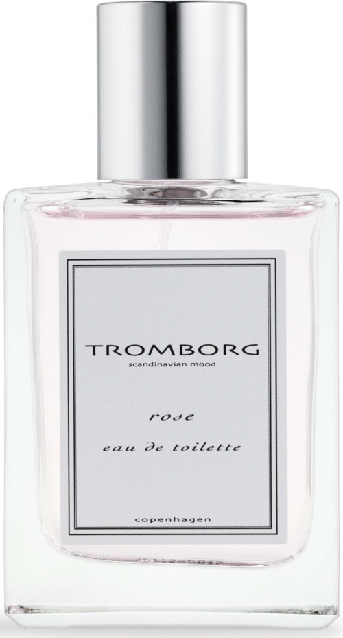 Eine transparente Parfüfflasche mit silberner Kappe, beschriftet 'Tromborg' und 'Rose Eau de Toilette'.