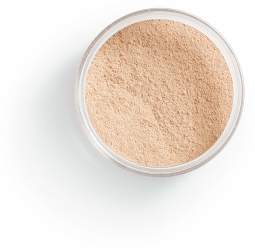 A round container filled with light beige powder, possibly makeup or a cosmetic product.