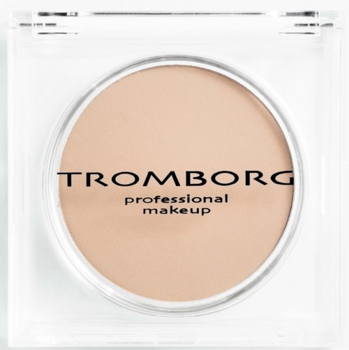 A round beige makeup product in clear packaging with black text, labeled 'Tromborg professional makeup.'