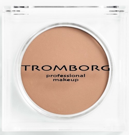 A beige powder in a clear round container with black text. The brand name is Tromborg and it says 'professional makeup'.