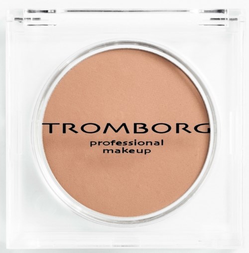 A compact of TROMBORG professional makeup with beige powder in a clear container.