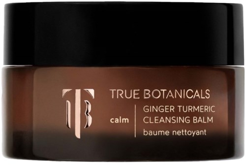 A jar of calming ginger turmeric cleansing balm from True Botanicals with a black lid and brown container.