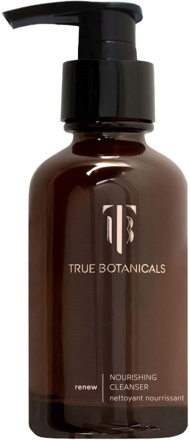 A dark brown bottle with a pump, labeled True Botanicals Nourishing Cleanser, used for skincare.