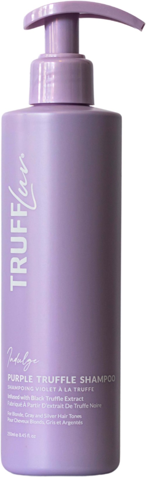 Een lange, paarse fles met pomp getiteld 'Truffle'. Het is shampoo, beschreven als paarse truffelshampoo met een dikke consistentie.