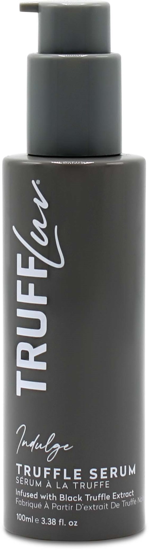 Een grijze fles met pomp, gemarkeerd "TRUFFLELOVE" en "Indulge". Bevat truffelserum met zwarte truffel-extract.