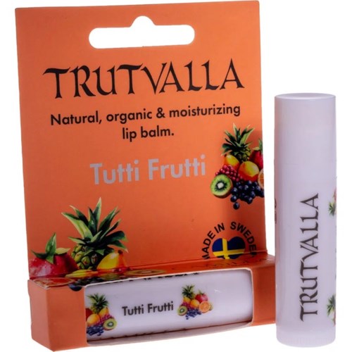 A lip balm in a white tube and orange box, featuring illustrations of various fruits and the brand name Trutvalla.