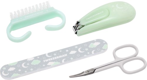 A set of small, pastel-colored nail tools including a clipper, scissors, and nail files with star motifs.