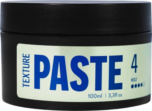Ett rör med textilmassa, 100 ml, med svart lock, märkt med nummer 4 och instruktioner att hålla.