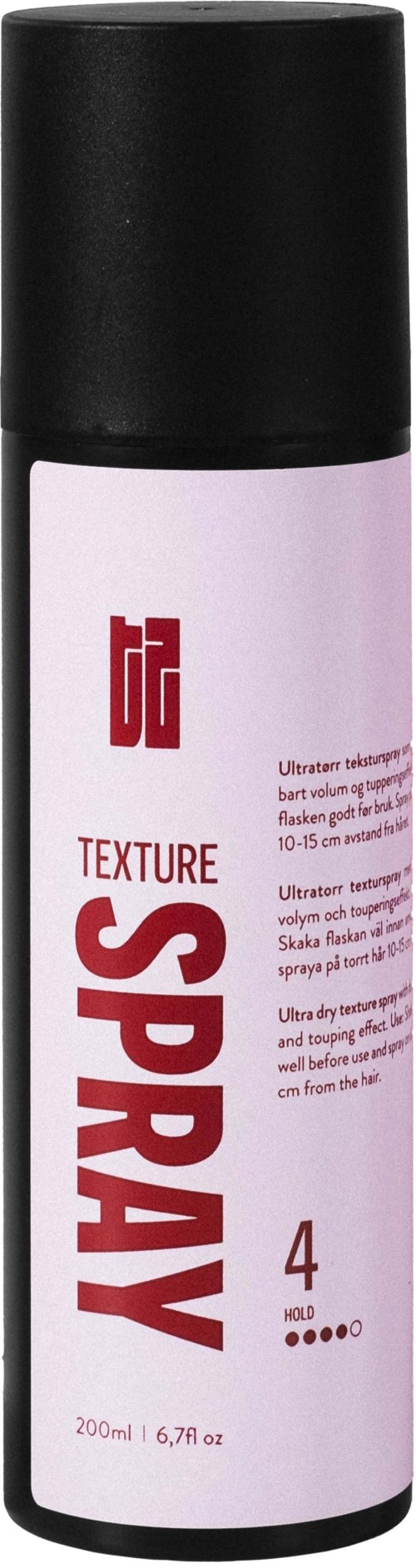 En vit och svart sprayburk med röd och lila text, märkt 'TEXTURE SPRAY', står upprätt.