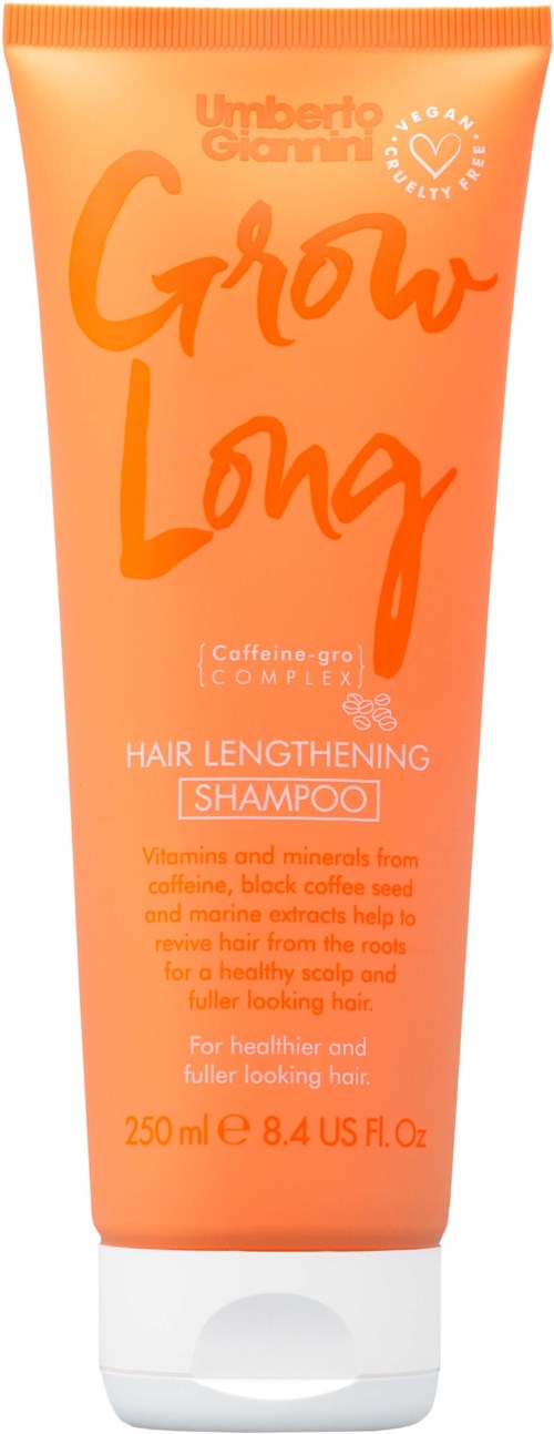 Oranssi shampoo pullo, jossa tekstiä hiusten kasvusta ja aineksista, 250 ml.
