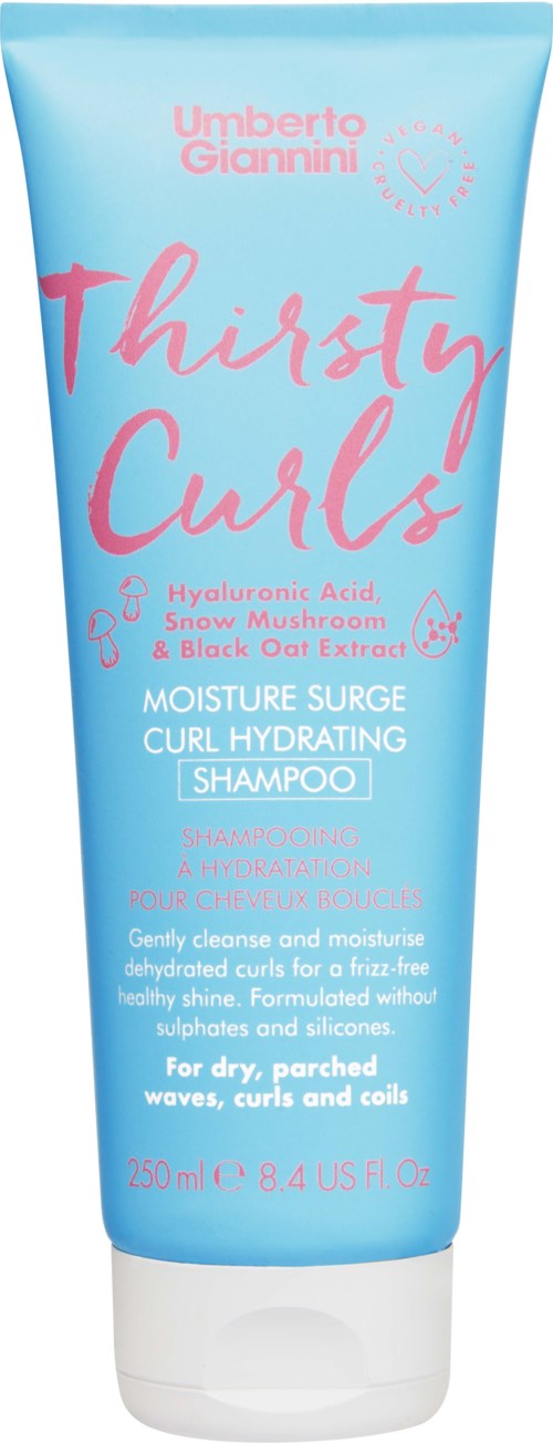 Een blauwe shampoo tube met roze kalligrafische tekst. Vermeldt hyaluronzuur en zwart haver-extract. Voor krullend haar.