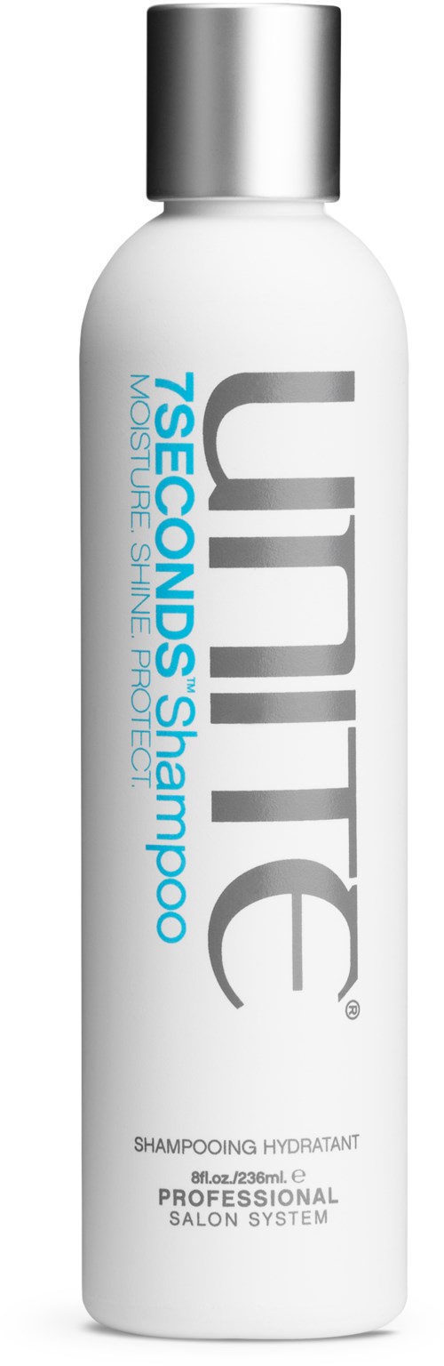 Vit flaska med silverlock, märkt 'Unit 7 Seconds Shampoo,' för professionell hårvård.