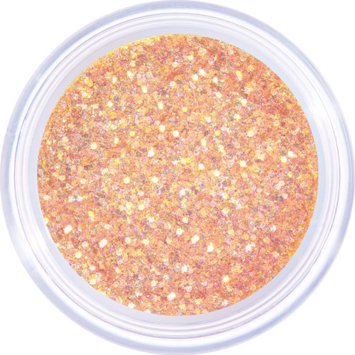A round container filled with peach-colored glitter that sparkles and shines.