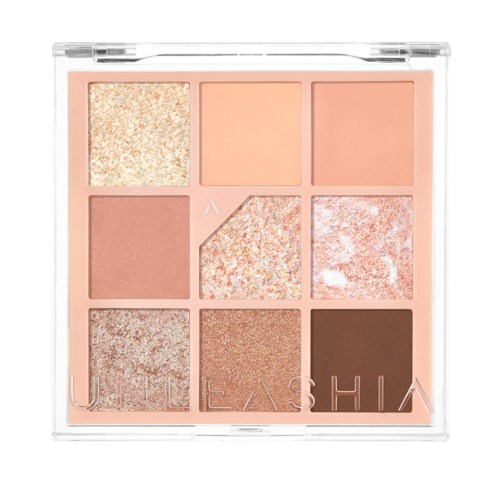 Een compacte make-up palette met negen tinten, inclusief glitter, blush en matte kleuren in lichte roze en bruin.