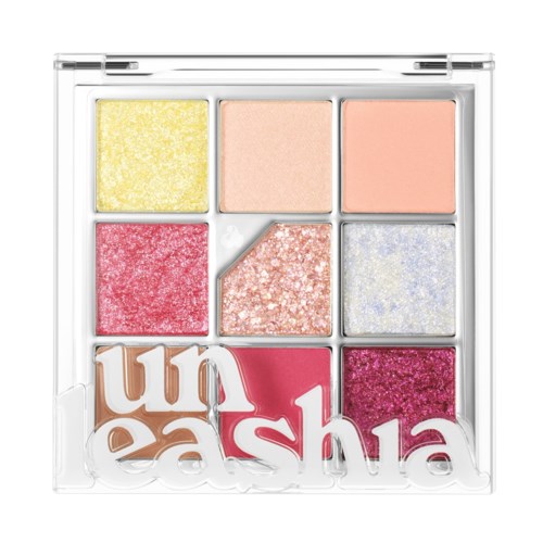 Een kleuren palet met zes oogschaduwtinten, waaronder geel, perzik, roze, rood, glitters en paars, met het woord 'unleash' onderaan.