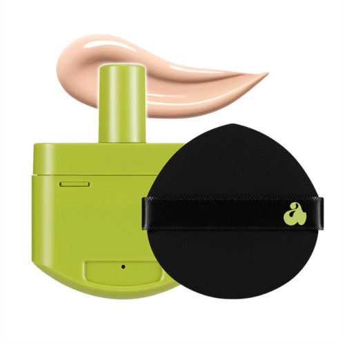 Groene huidverzorgingsapparaat met crème, zwarte spons met gele logo.