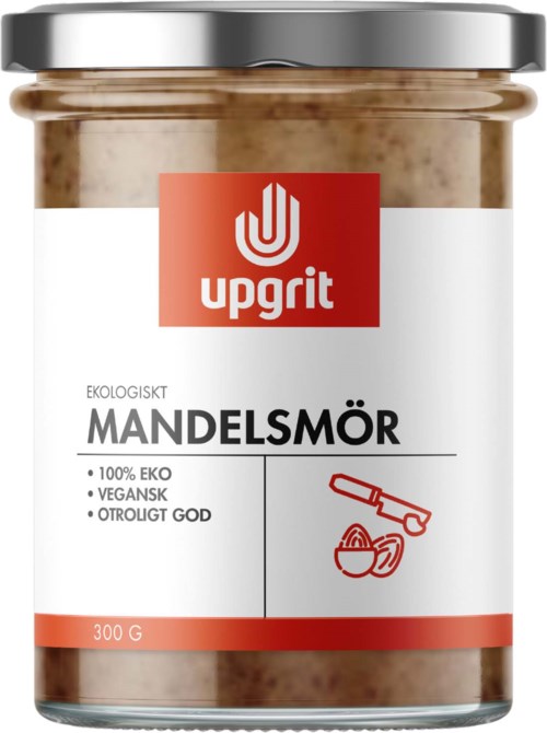 A glass jar of almond butter with a white and red label, showing brand Upgrit, eco-friendly, vegan, 300 grams.