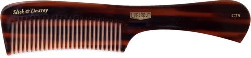 A brown and black hair comb with the words "Slick & Destroy" written on it.