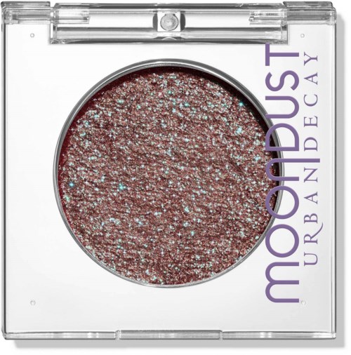 Pink glitter eyeshadow in clear square compact with purple Urban Decay logo.